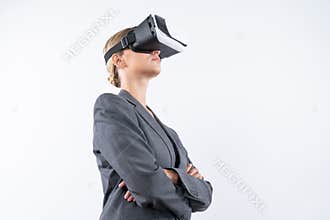 Caucasian businesswoman crossing arms while wearing VR glasses. Contraption.