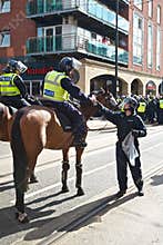 Mounted policeman receives water