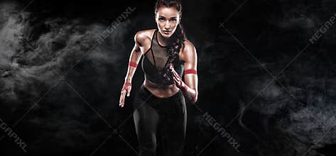 Runner. Athletic, woman sprinter, running on black background. Fitness and sport motivation. Running concept with copy