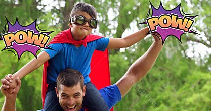 Father and son in superhero play with comic-style Pow! speech bubble