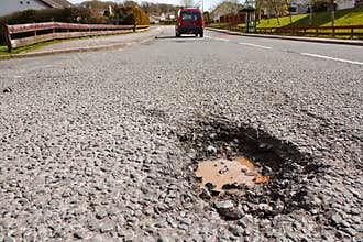 Pot hole in residential road surface