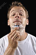 Man shaving chin