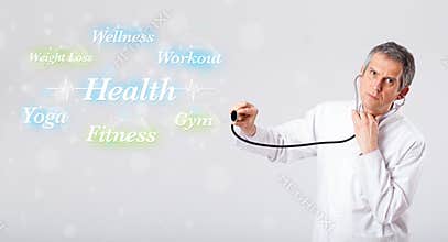 Clinical doctor pointing to health and fitness collection of words