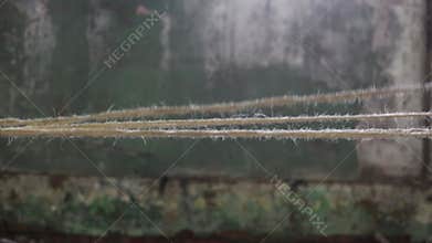 Moving ropes in industrial building with old