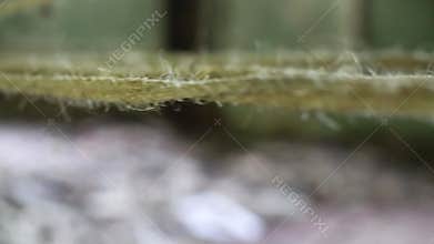 Close up of moving ropes in industrial building