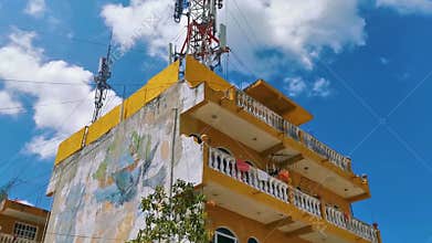 Yellow buildings architecture hotels apartments palm Playa del Carmen Mexico