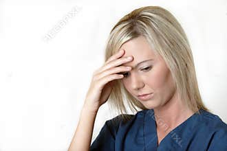 Pretty nurse with a stress headache