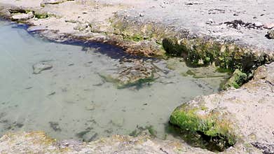 Small mini cenote cave at beach ocean with sand Mexico