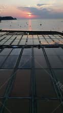Strunjan traditional salt pans at sunset with reflections aerial vertical