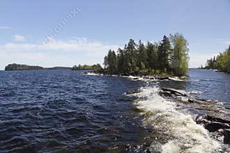 Waves on rocks near islets on Lake Ladoga