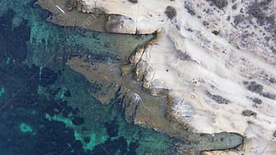 The quadcopter flies up from the person.