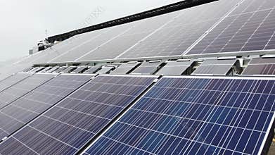 Assembly of solar panels on metal truss structure located on a rooftop