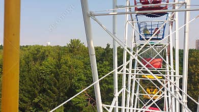 Areal slow motion footage of urban city made from ferris wheel. Concept
