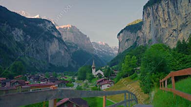 Lauterbrunnen, Switzerland. Strolling through the incredible views of a famous Swiss village with a waterfall in the