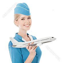 Charming Stewardess Holding Airplane In Hand. Isolated