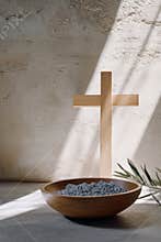 Religion, faith, liturgy, Ash Wednesday, Lent background. Brown wooden cross, ceremonial ash bowl and olive branch on
