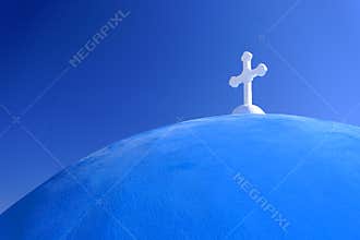 White cross on blue domed church