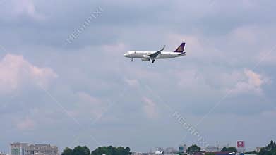 Airplane airbus A321 of Cambodia Angkor Air flying through sky prepare to landing