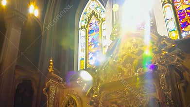 Sun shining through stained glass windows in church