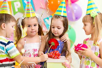 Children with gifts on birthday party