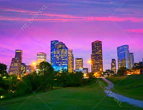 Houston Texas modern skyline at sunset twilight from park