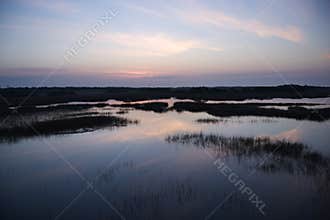 Sky reflecting in marsh.