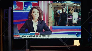 Smart TV displaying news program broadcasting with journalist talking about cybercriminals attacks