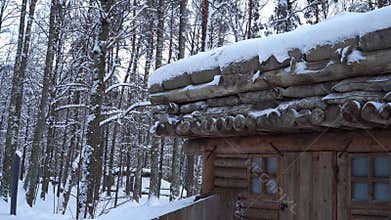 An authentic dugout log building roof construction in winter