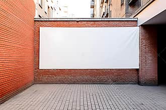 Empty white billboard with copy space for mockup mounted on red brick wall
