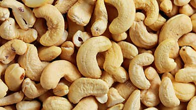 Cashew nuts on a turntable from overhead, Rotating cashew nuts view from above. Cashew nuts rotating