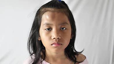 Little Asian girl with swollen bump on her forehead