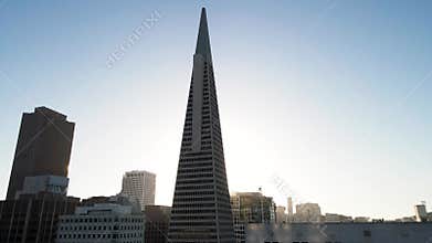 City skyline with modern skyscrapers under clear skies at dusk