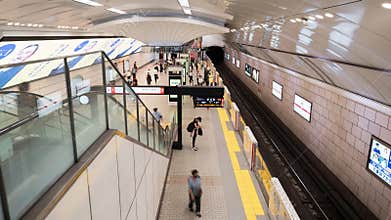 Timelapse of busy crowded Japanese people passenger at subway station transportation platfor