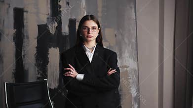 Female business portrait confident Caucasian businesswoman posing in office with hands crossed Caucasian girl confident