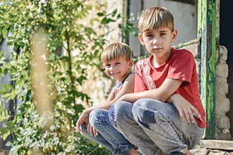 Children in a burnt house lost their homes as a result of hostilities and natural disasters