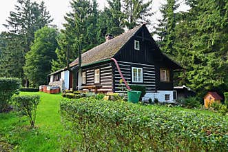 Beautiful old traditional house in the mountains in the Czech Republic. Cottage in nature