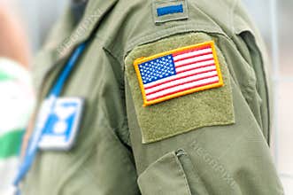 Focus on american flag on USAF uniform of person.