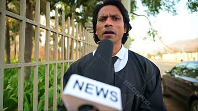 A lawyer in black robe is being address anchor