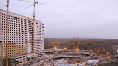 People constructing a building and a parking in