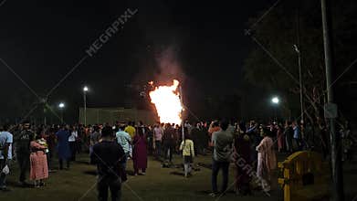 People gathering for celebrating Holika also called Holika Dahan or Chhoti Holi on the night before holi