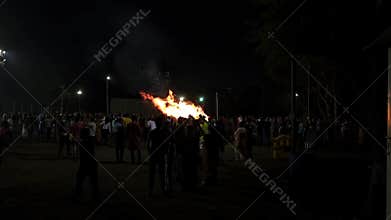 People gather a day before Holi, to celebrate Holika or Simhika by igniting a pyre called Holika Dahan