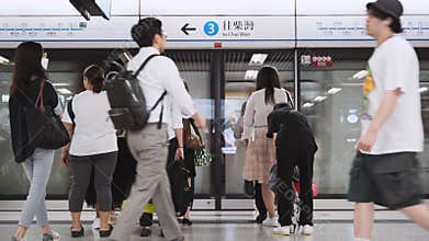 Crowd of Asian people, tourist traveler walk at Central subway underground station