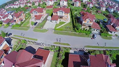 Many similar houses in cottage village at sunny