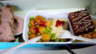 Lunch in an airplane with a chop, potato balls,