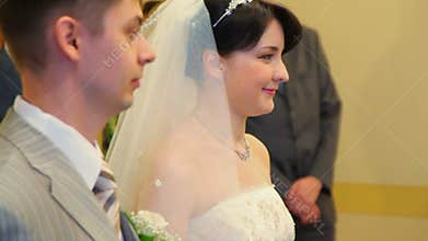 bridegroom and bride during registration in