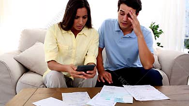 Stressed couple because of bills to pay