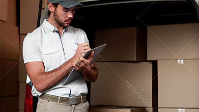 Delivery driver checking his list