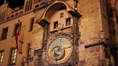 Prague Astronomical Clock Orloj at night, showing mechanical figures of the apostles moving in the windows during the hourly show