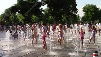 Children playing with the water flushes