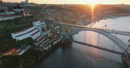 Sun setting over Dom Luis I Bridge Porto Portugal